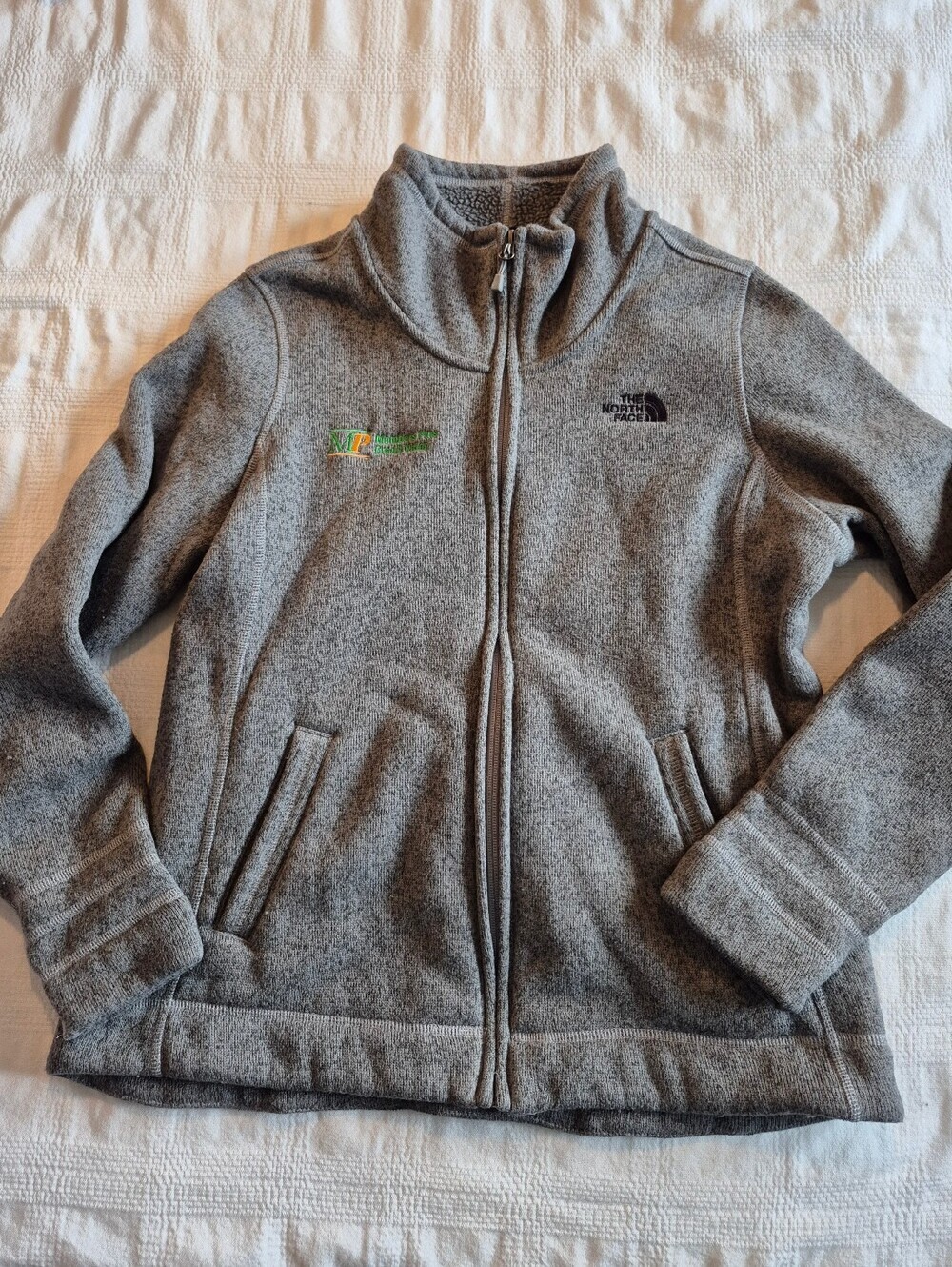 North Face women's XL sherpa lined full zip up gray sweater, company name on